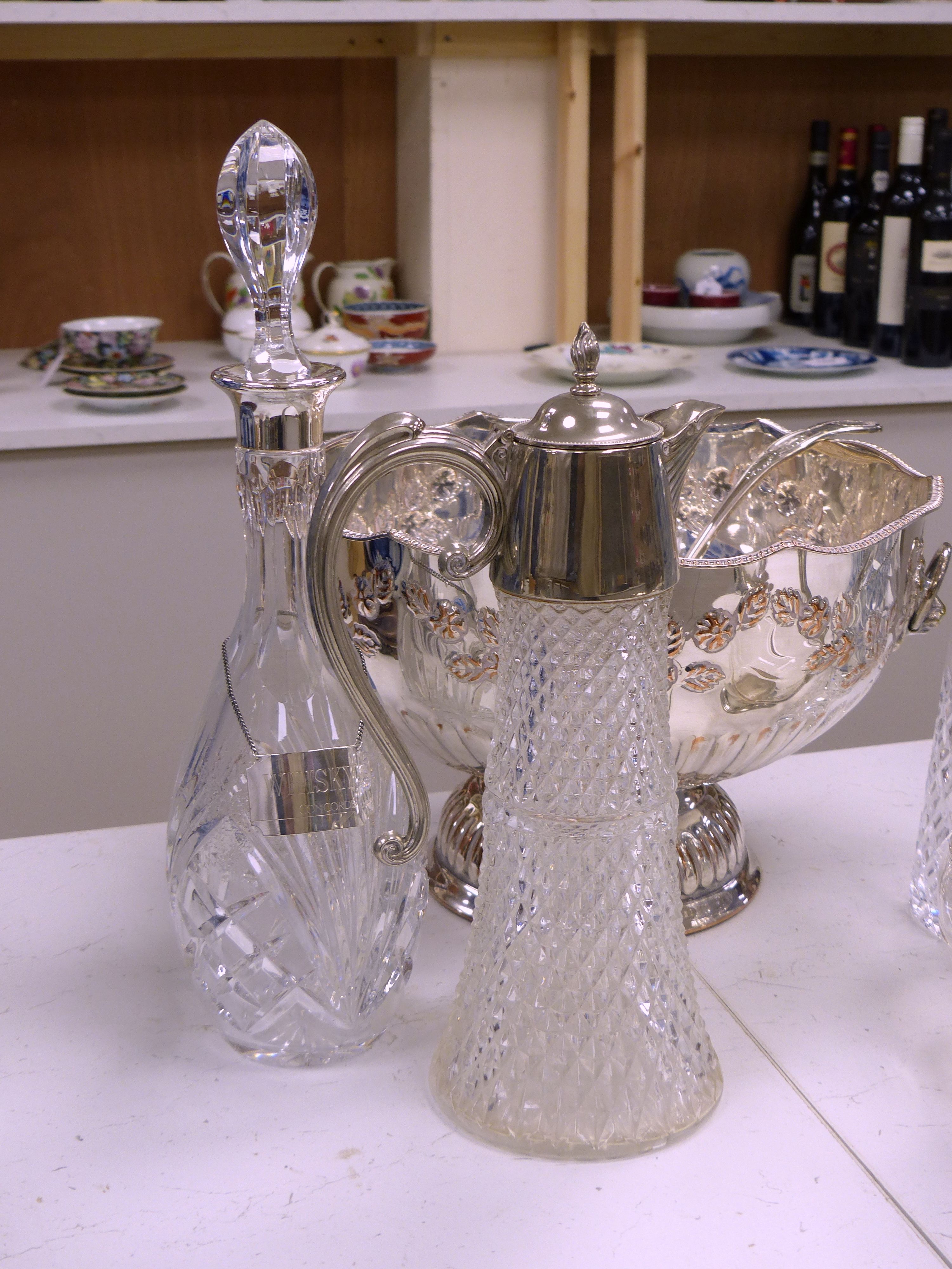 Two cut glass decanters (one silver-mounted), two silver Whisky and Gin labels, an 'Etains du Manoir' duck shaped wine carafe and two other items